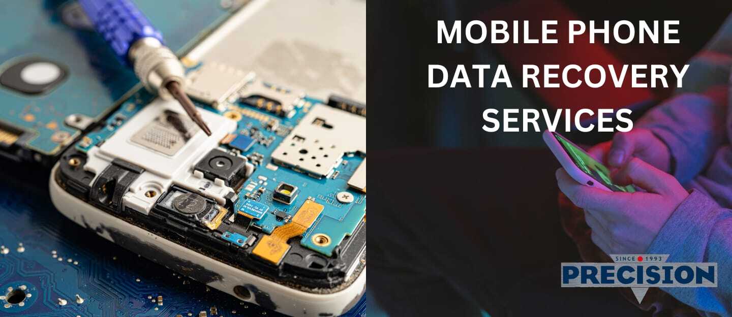 Technician repairing a mobile phone motherboard for data recovery